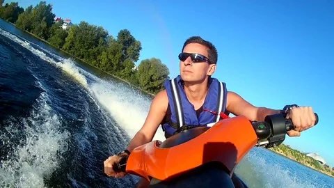 Man rides a jet ski  Stock Footage 70177192