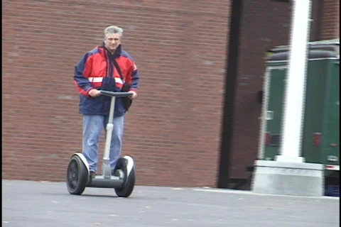 Man Rides on Segway Stock Footage 297864