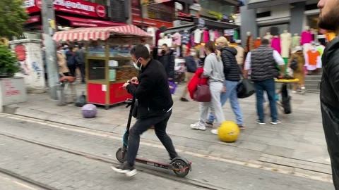 Man rides a shared E-Scooter in Istanbul, Turkey 4K Stock Footage 165955096