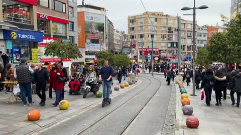 Man rides a shared E-Scooter in Kadikoy district, Istanbul, Turkey 4K Stock Footage 165955415