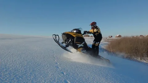 Man rides a snowmobile 2 Stock Footage 99925490