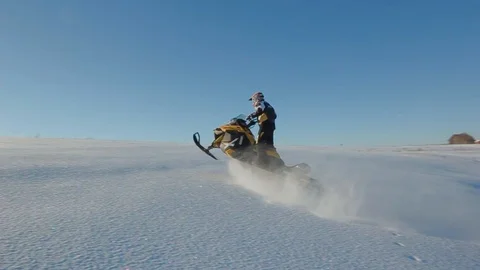 Man rides a snowmobile 4 Stock Footage 99925441