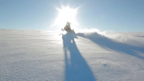 Man rides a snowmobile Stock Footage 99925854