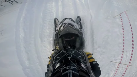 Man rides a snowmobile on a snowy path past the trees Stock-Footage 102207220