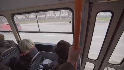Man rides a Soviet tram and looks out the window. point of view Stock Footage 129558949