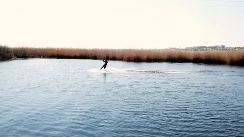 A man rides wakeboarding Stock Footage 107538289