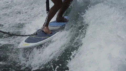 A man rides on a wave in Dubai Stock Footage 131953339