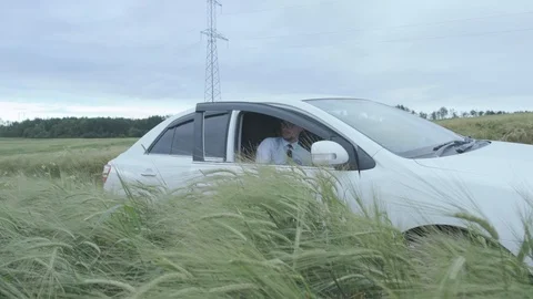 Man rides on a wheat field Stock Footage 118680679