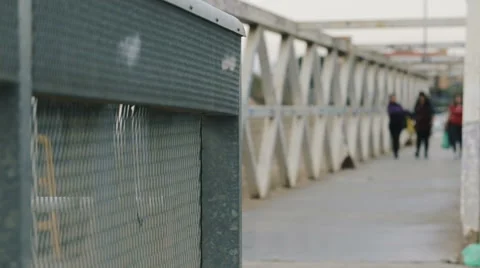 Man riding a bicycle on a bridge. 库存影片 62272211