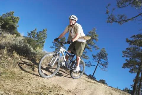 Man Riding Bicycle Stock Photos
