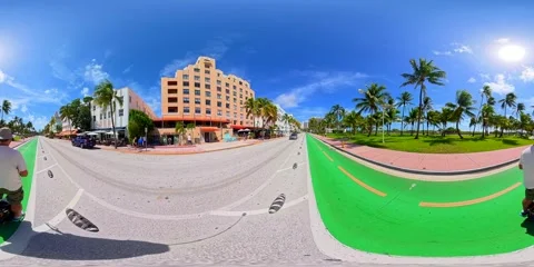 Man riding Electric Unicycle EUC in Miami Beach Ocean Drive. Filed on a 8k .. Stock Footage 318410423