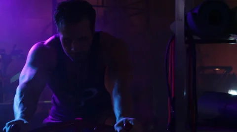 Man Riding Exercise Bike Stock Footage 32399153