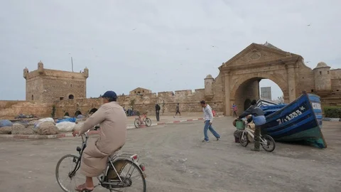 A man riding his bicycle in Marrakech port, Morocco, Africa in 4K Stock Footage 93857265