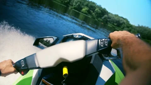 Man riding a jet ski against the background of the beautiful sea. Riding on Stock Footage 201518582