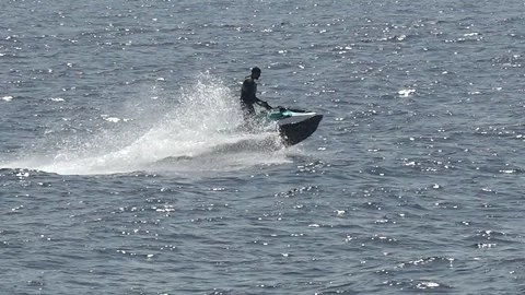 Man riding a jet ski in the sea at benidorm city Stock Footage 315164553