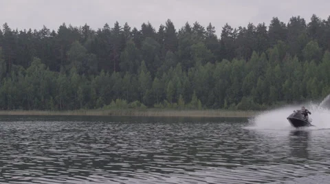 Man riding a jetski Stock Footage 62758118