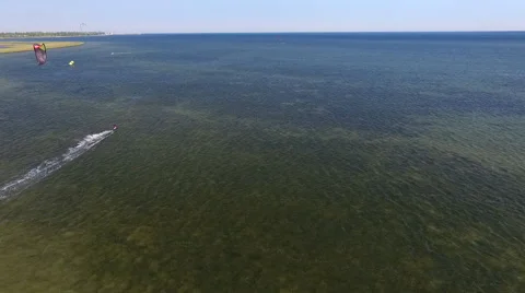 Man Riding a Kite on the Sea Stock Footage 64204235