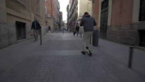 Man riding a lime s  Electric scooter Stock Footage 97498051