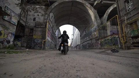 A man riding a motorcycle in a tunnel Stock Footage 129105059