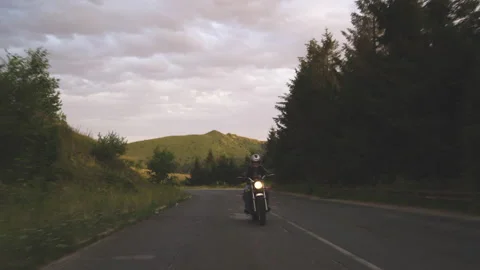 Man riding motorcycle on windy mountain asphalt road Stock Footage 158812102