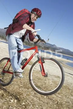 Man Riding Mountain Bike Stock Photos
