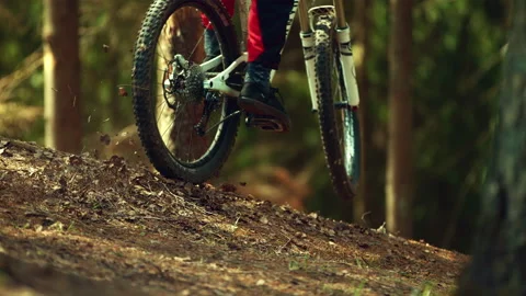 A man riding mtb down the hill in a forest in super slow motion Stock Footage 146852683