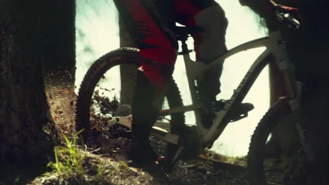 A man riding mtb down the hill in a forest in super slow motion Stock Footage 146852941