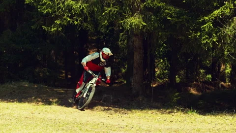 A man riding mtb down the hill in a forest in super slow motion, falling Stock Footage 146857625