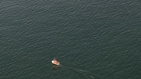 Man riding a new ocean thrill craft called an electric hydrofoil Stock Footage 252154711