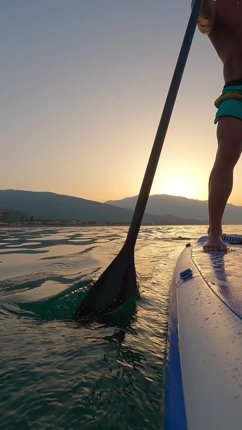Man Riding Paddleboard On Sunset Stock Footage 247140151