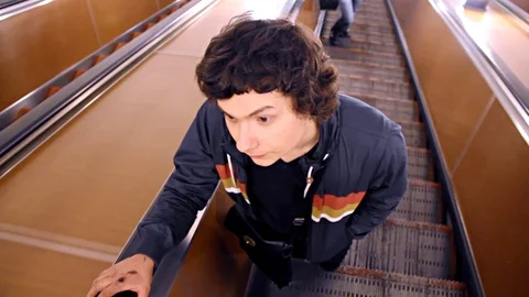 Man Riding By The Subway Escalator Stock Footage