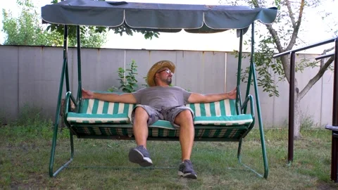 A man riding a swing 4K Video stock 160110083