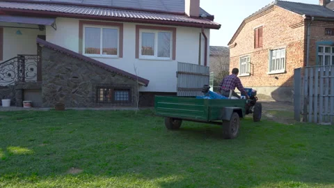 Man riding a two wheeled tractor Stock Footage 147878983