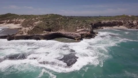 A man riding a wave on top of a body of water 動画素材 156342016