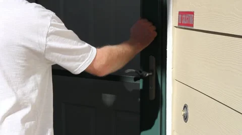 Man Ringing Front Door Bell and Knocking Stock Footage 12331432