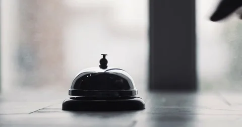 Man ringing hotel reception bell, male hand pushing accommodation call bell on Stock Footage 78175174