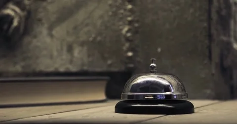 Man ringing hotel reception bell, male hand pushing accommodation call bell on Video stock 78175947