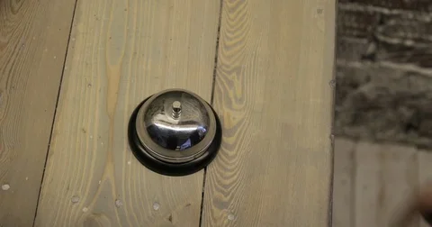 Man ringing hotel reception bell, male hand pushing accommodation call bell on Stock Footage 78176564