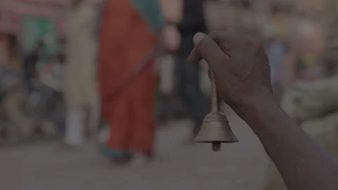 A man ringing the temple bell in the varanasi market Stock Footage 220906096