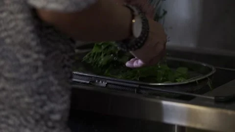 A man rinsing vegetable in a sink Stock Footage 146250191