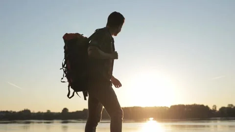 Man rise hands on top of mountain beyond sky. Concept of freedom. Young man Vidéo 144412242
