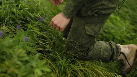 Man rises up to the grass Video stock 93539237
