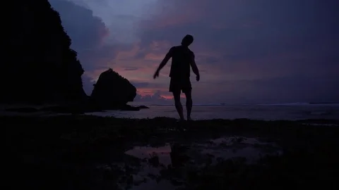 Man rising hands, posing like athlete at sunrise Stock Footage 84422694