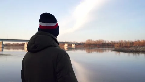 Man on the river bank Stock Footage 179837106