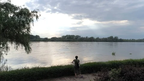 Man by the river, high water level, aerial view Stock Footage 120399062