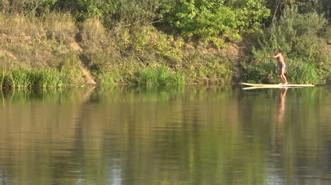 A man on the river, Paddle Board Video stock 55204423