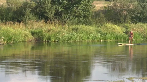 A man on the river, Paddle, board Stock Footage 55204692
