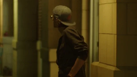 Man Roams a Dark City Stock Footage 77209704