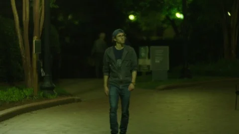Man Roams a Dark City Stock Footage 77209989