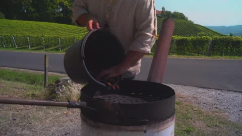 Man roast chestnuts on an open fire Video stock 145729828